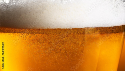 Delicious-looking beer poured into glass. Beer pale golden color and has thick, white head of foam. Textured photo. Abstract background. photo