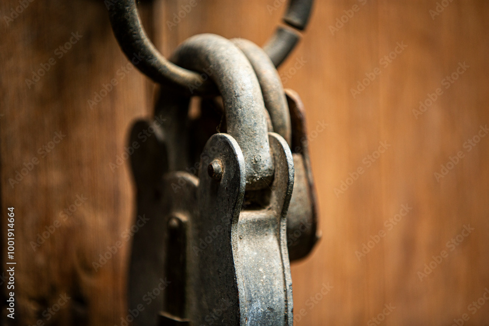 Old rusty padlock on a wooden door. Shallow depth of field. Old rusty padlock on a wooden door. Shallow depth of field.