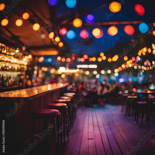 Bokeh background of bar counter with colorful dim lights and foldable camping chairs outside at night 