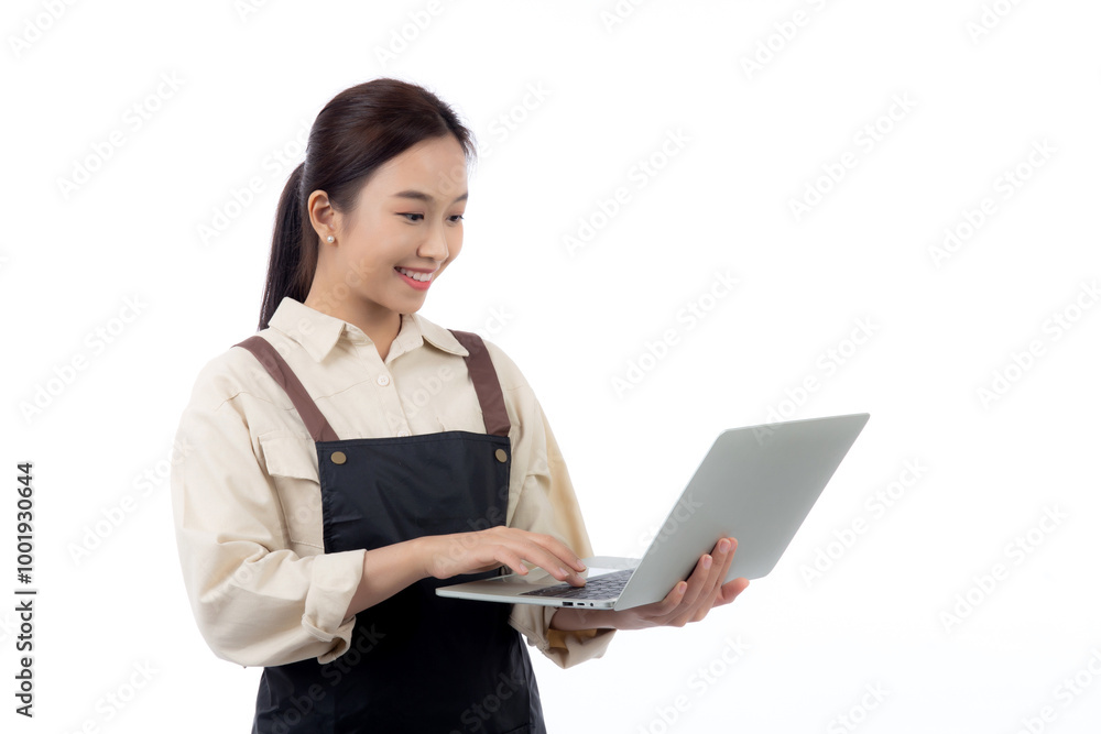 Portrait young asian business woman wearing apron holding laptop computer isolated white background, waitress or barista holding laptop computer with confident, cut out, business or freelance. Portrait young asian business woman wearing apron holding laptop computer isolated white background, waitress or barista holding laptop computer with confident, cut out, business or freelance.