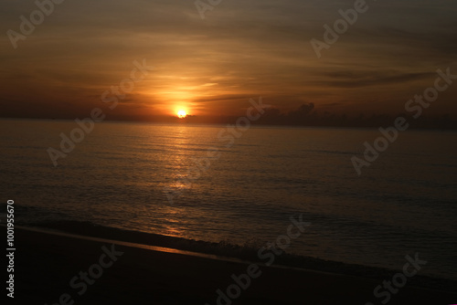 The sun rises at the sea in the morning. photo