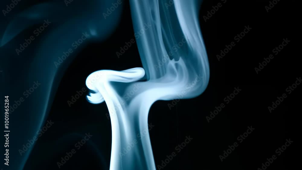 Abstract blue smoke wisps against a black background Abstract blue smoke wisps against a black background