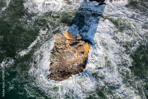 High quality aerial drone photo of Devil's Cauldron at Elk Flats Trail in the beautiful Oregon Coast, near Manzanita, rocky beaches, and great views towards the Pacific Ocean.   photo