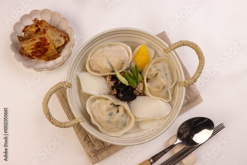 Tteok Mandu Guk is Korean Dumpling and Rice Cake Soup for New Year Celebration. photo