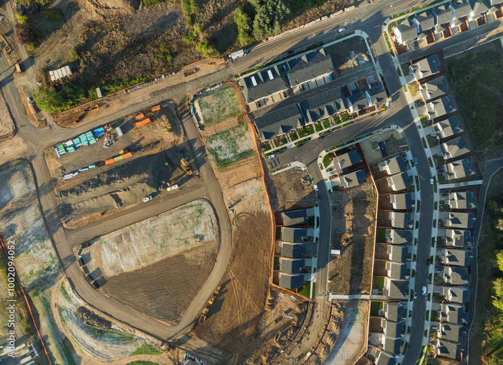 A view of a residential area with houses and a construction site