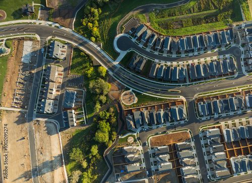 A residential area with many houses and a park photo