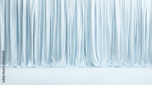 A soft, flowing light blue curtain drapes elegantly, creating a serene and tranquil atmosphere, ideal for events or photography settings.