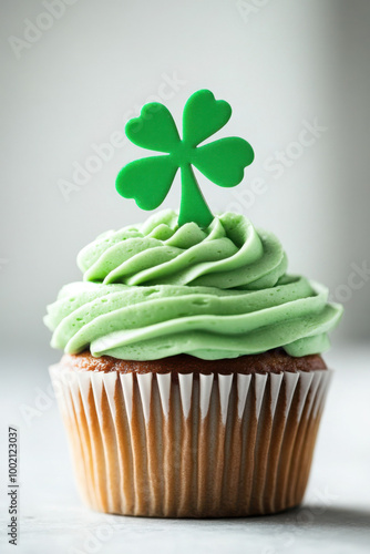 Wallpaper Mural Delicious vanilla cupcake with green frosting, topped with a shamrock decoration, symbolizing St. Patrick's Day celebrations. Torontodigital.ca