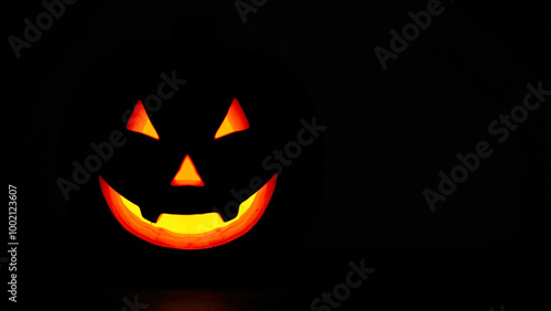 Close Up Of A Lit Jack-O'-Lantern In The Darkness