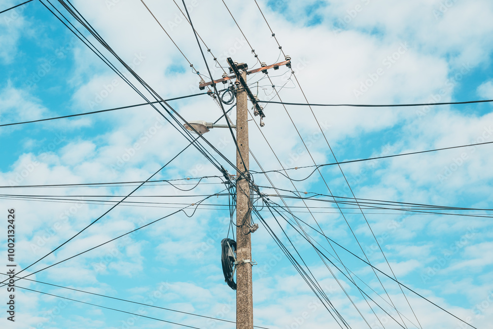 Concrete electrical post with cables and wires spreading in all directions Concrete electrical post with cables and wires spreading in all directions