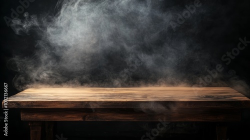 Wooden table with smoke effect on dark