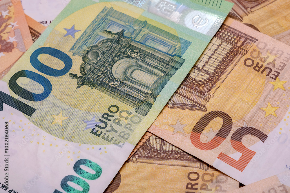 Close-up of scattered moneys. Euro banknotes as a background. Financial background photo. Close-up of scattered moneys. Euro banknotes as a background. Financial background photo.