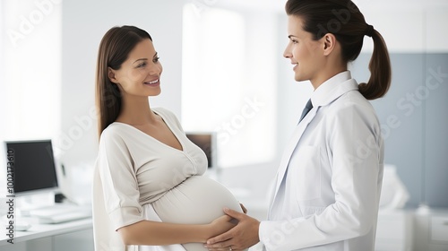 Expecting mother receives prenatal care advice during a doctor's visit in a modern clinic photo