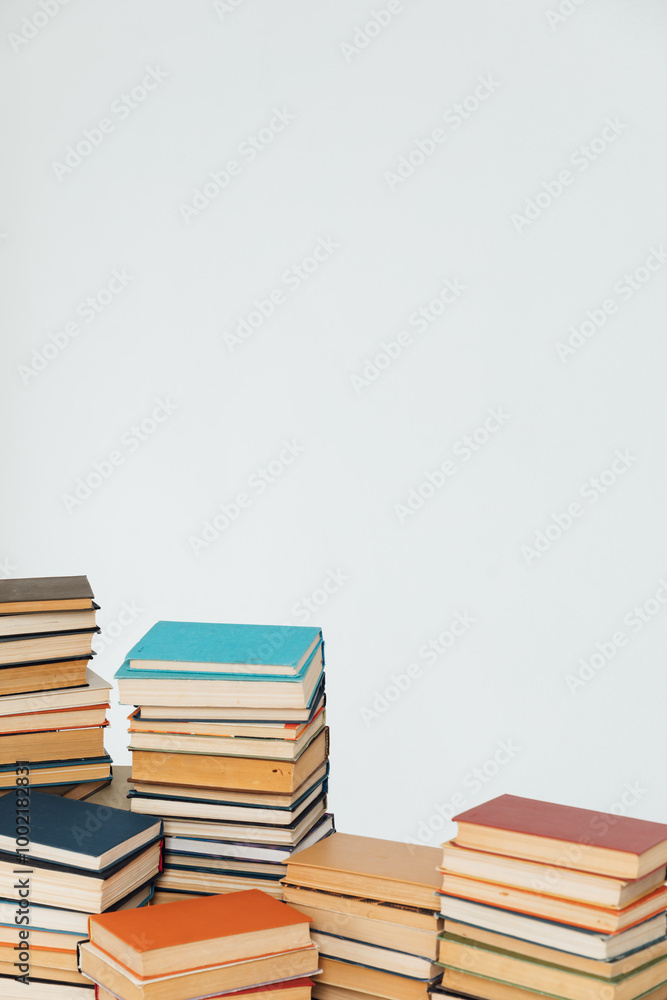 Stacks of educational books for teaching in the library on a white background Stacks of educational books for teaching in the library on a white background