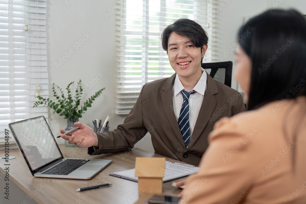 Real Estate Agent Discussing Housing Opportunities with Potential Buyer Real Estate Agent Discussing Housing Opportunities with Potential Buyer