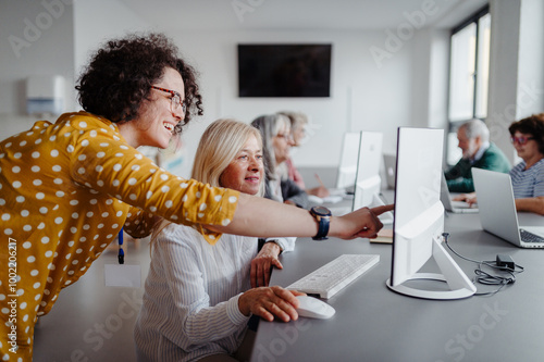 Canvas Print Portrait of female senior student learning how to work with digital technology