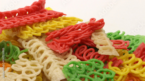 Colorful crackers or krupuk unfried isolated photo