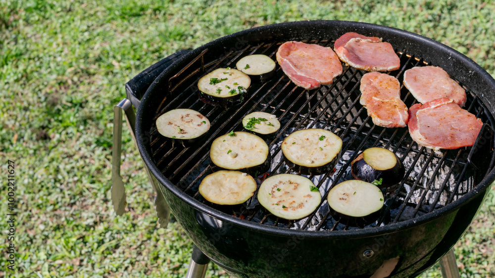 Grilling meat and vegetables on a charcoal barbecue in the backyard, perfect for summer cookouts and family gatherings Grilling meat and vegetables on a charcoal barbecue in the backyard, perfect for summer cookouts and family gatherings