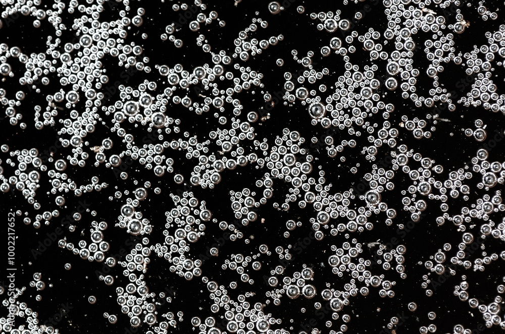 Balls of air on the surface of the water as a background. Macro Balls of air on the surface of the water as a background. Macro