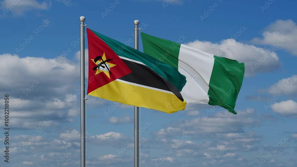 Nigeria and Mozambique flags flying together, video concept of the relationship, two country relations concept Nigeria and Mozambique flags flying together, video concept of the relationship, two country relations concept