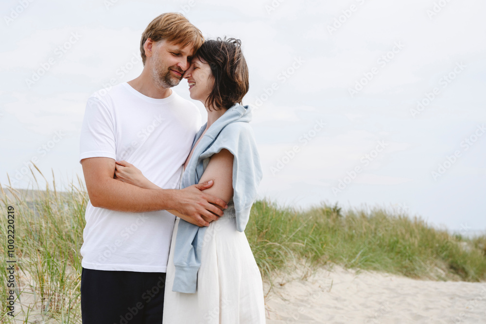 Affectionate couple standing at beach Affectionate couple standing at beach