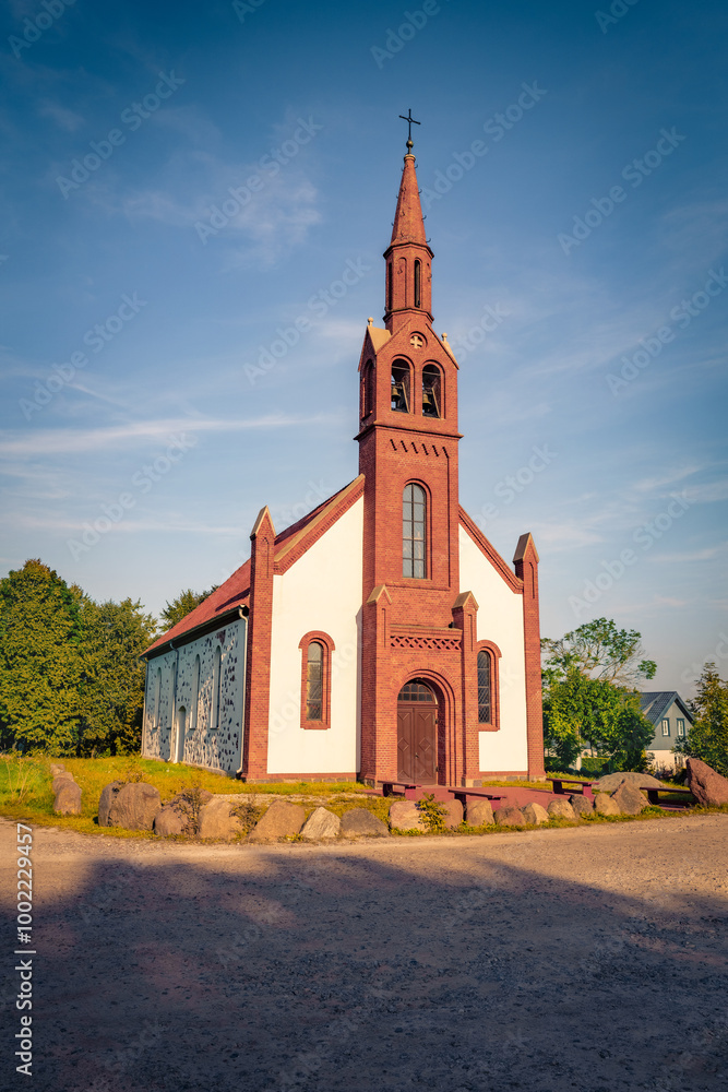 Naklejka premium Majestic summer view of Kretingale Evangelical Lutheran Church. Colorful morning scene of Kretingale town, Klaipeda County, Lithuania, Europe. Traveling concept background.