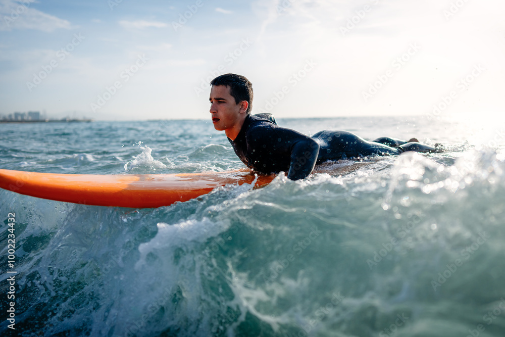 Happy young fit man with surfing board at beach, sea and ocean for summer. Travel adventure or hobby Happy young fit man with surfing board at beach, sea and ocean for summer. Travel adventure or hobby