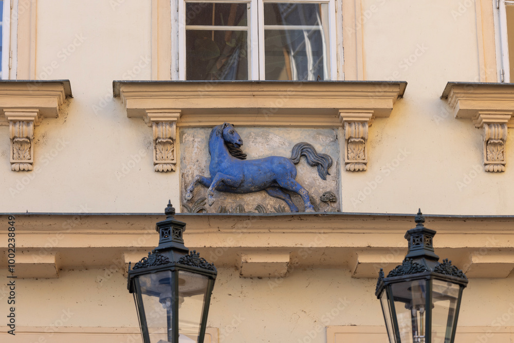 Relief of blue horse on facade of townhouse on Male namesti square, Old Town, Prague, Czech Republic