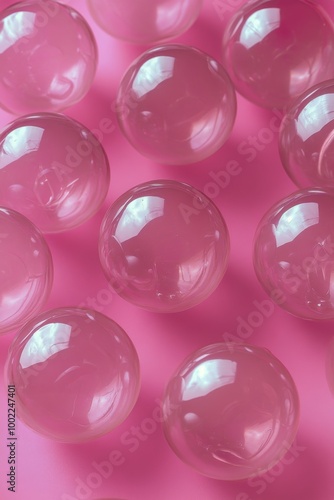 Clear pink bubbles arranged on a pink background