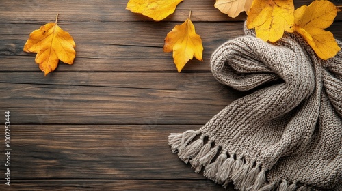 Colorful knitted scarves arranged on a wooden surface in warm light