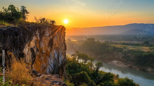The stunning cliffs of Pha Taem National Park at sunrise, overlooking the Mekong River and Laos beyond.