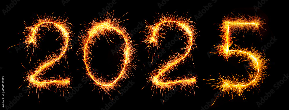 Number 2025 (New Year) is written with burning sparklers on a black background. Number 2025 (New Year) is written with burning sparklers on a black background.