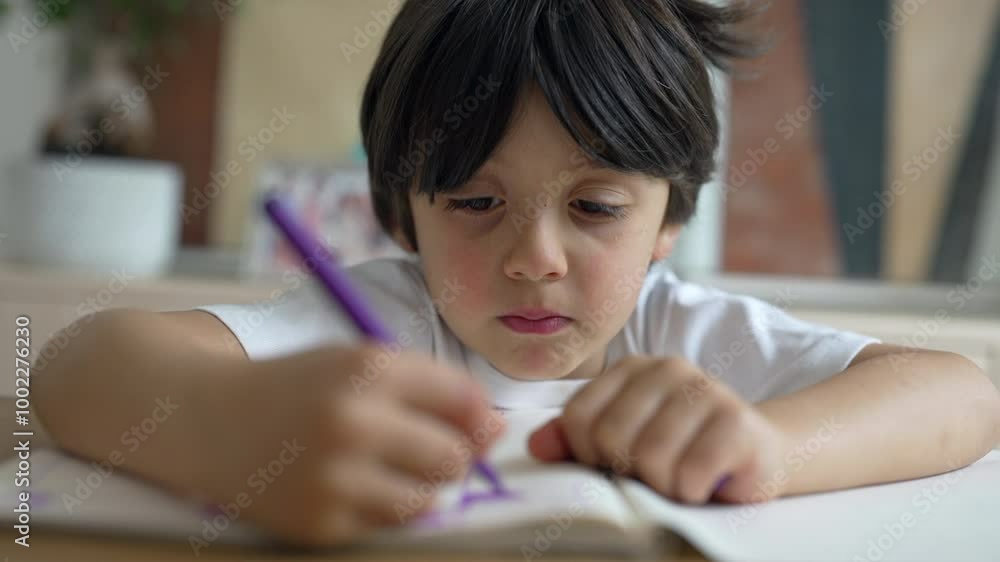 Young child intently drawing with a purple marker, focus on the face and hand, creating artwork, close-up of artistic activity in a home setting, childhood creativity and concentration Young child intently drawing with a purple marker, focus on the face and hand, creating artwork, close-up of artistic activity in a home setting, childhood creativity and concentration