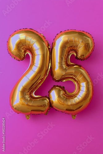 A vibrant display of golden balloons against a pink backdrop