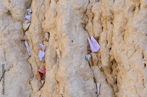 Tiny prayer notes inserted into the cracks and crevices of the Western Wall holy site in Jerusalem, Israel. photo