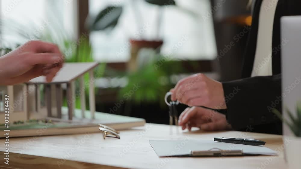 Man sign mortgage contract, put signature on sale purchase rental agreement, handshaking realtor at meeting with estate agent, satisfied customers buy property, get keys of new home. Man sign mortgage contract, put signature on sale purchase rental agreement, handshaking realtor at meeting with estate agent, satisfied customers buy property, get keys of new home.