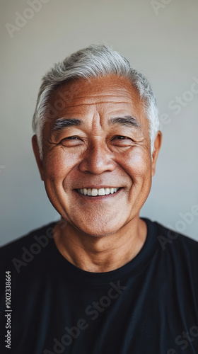 A front portrait of an elderly Asian man, smiling, centered in the frame, short silver hair photo