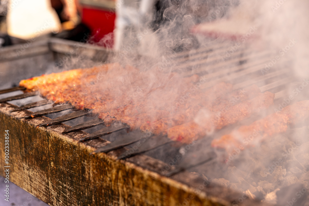 Turkish Kebab On The Grill. Barbecue grliling shish kebab , shish kebab in smoke over coal fire Turkish Kebab On The Grill. Barbecue grliling shish kebab , shish kebab in smoke over coal fire