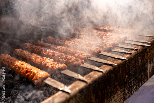  Turkish Kebab On The Grill. Barbecue grliling shish kebab , shish kebab in smoke over coal fire