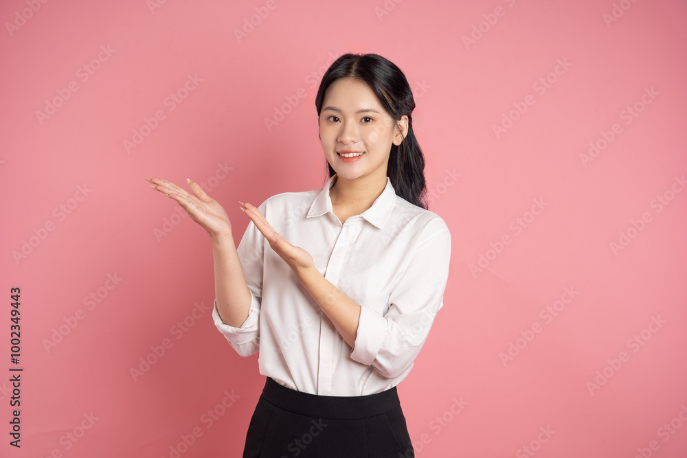 portrait of Asian business woman posing on pink background portrait of Asian business woman posing on pink background