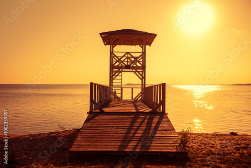 Wooden lifeguard tower on the beach during sunset at Shatsky Lakes, Ukraine