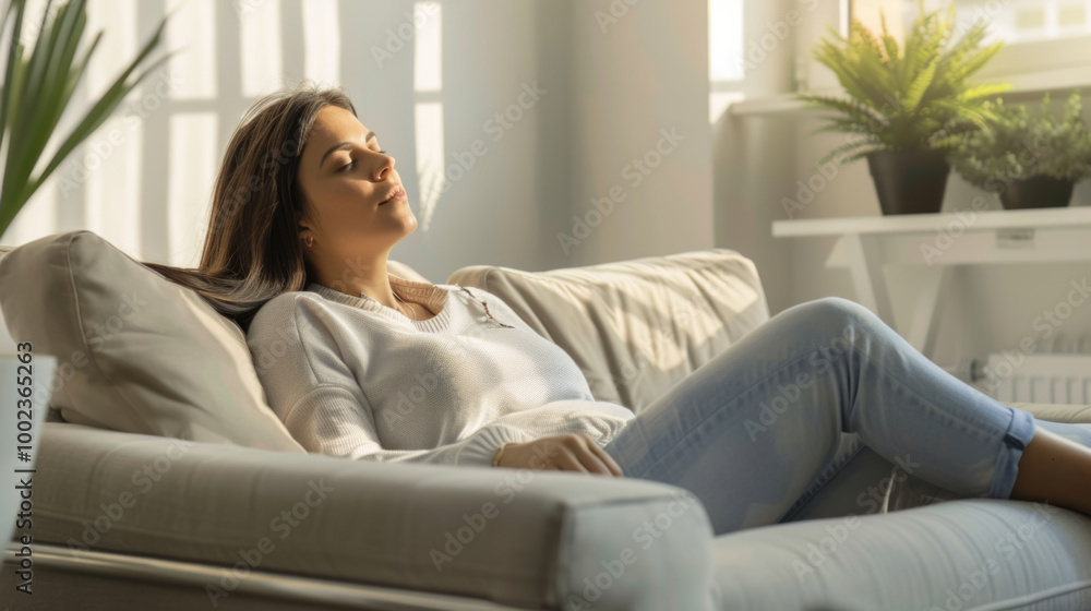 A person reflects and relaxes on a couch during a therapeutic session in a sunlit room A person reflects and relaxes on a couch during a therapeutic session in a sunlit room