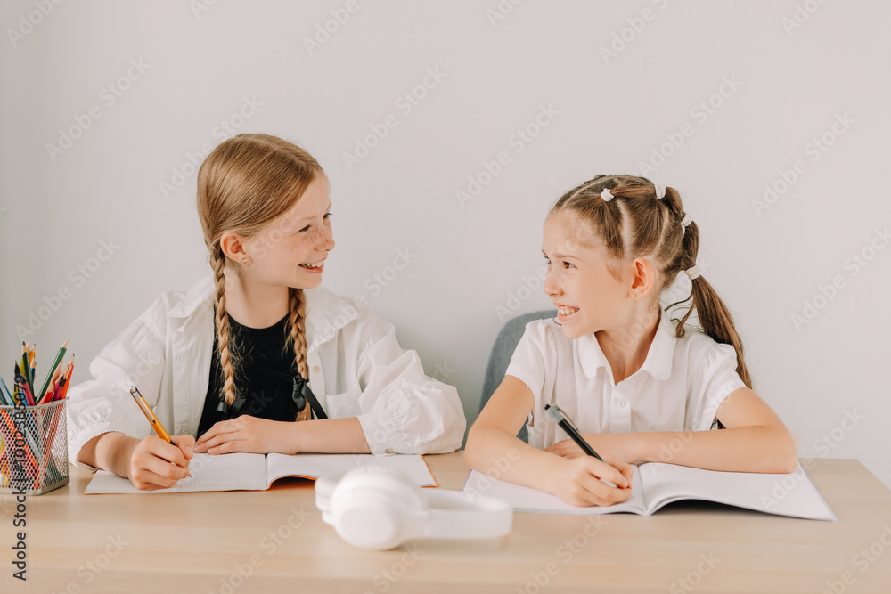 Two young students having fun while studying together at home Two young students having fun while studying together at home