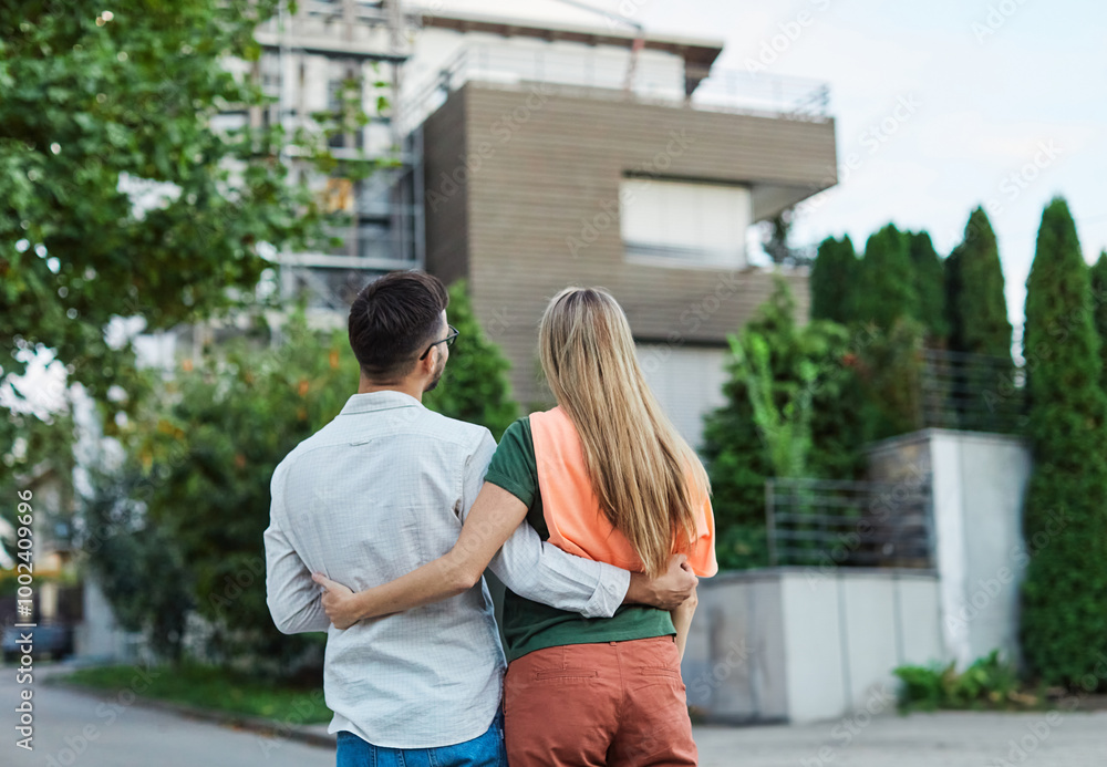Fototapeta premium key woman man house new apartment home wife husband owner real estate togetherness couple buying happy young married together family property portrait