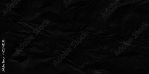 Black crumpled paper texture . Black wrinkled paper texture. Black paper texture . Black crumpled and top view textures can be used for background of text or any contents .