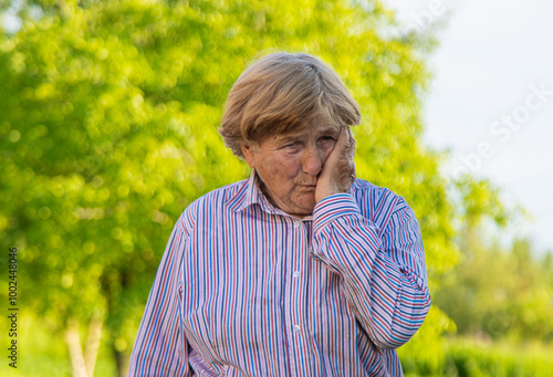 Old woman has toothache. Selective focus.