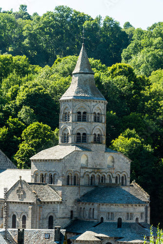 Basilica Notre Dame d'Orcival. Natural regional park of volcans d'auvergne. Puy de Dome. Auvergne Rhone Alpes. France photo