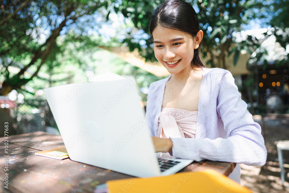 Beautiful confident freelancer asian young woman working with laptop Hands typing keyboard. digital nomad working remotely from outdoor eco cafe Workplace on nature outdoors Beautiful confident freelancer asian young woman working with laptop Hands typing keyboard. digital nomad working remotely from outdoor eco cafe Workplace on nature outdoors