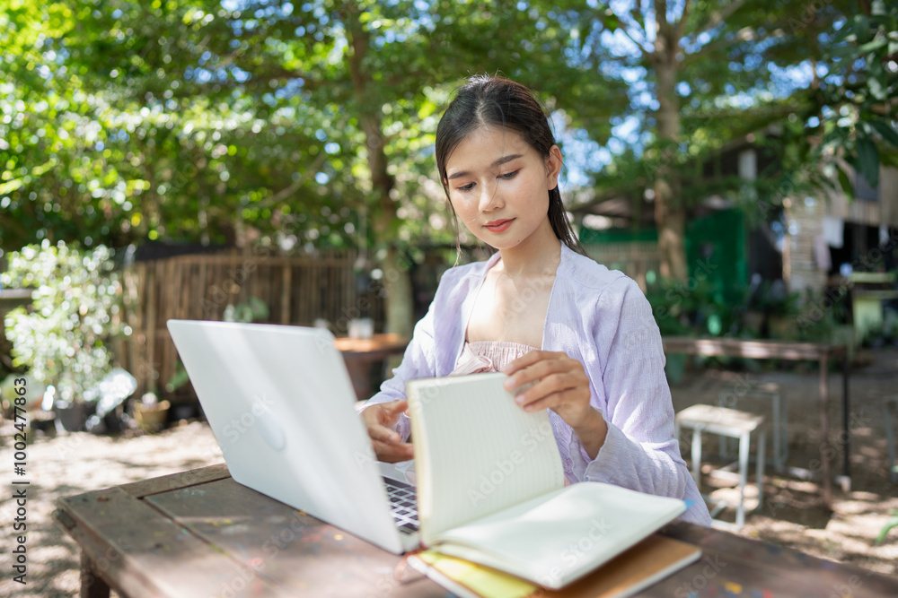 Beautiful confident freelancer asian young woman working with laptop Hands typing keyboard. digital nomad working remotely from outdoor eco cafe Workplace on nature outdoors Beautiful confident freelancer asian young woman working with laptop Hands typing keyboard. digital nomad working remotely from outdoor eco cafe Workplace on nature outdoors