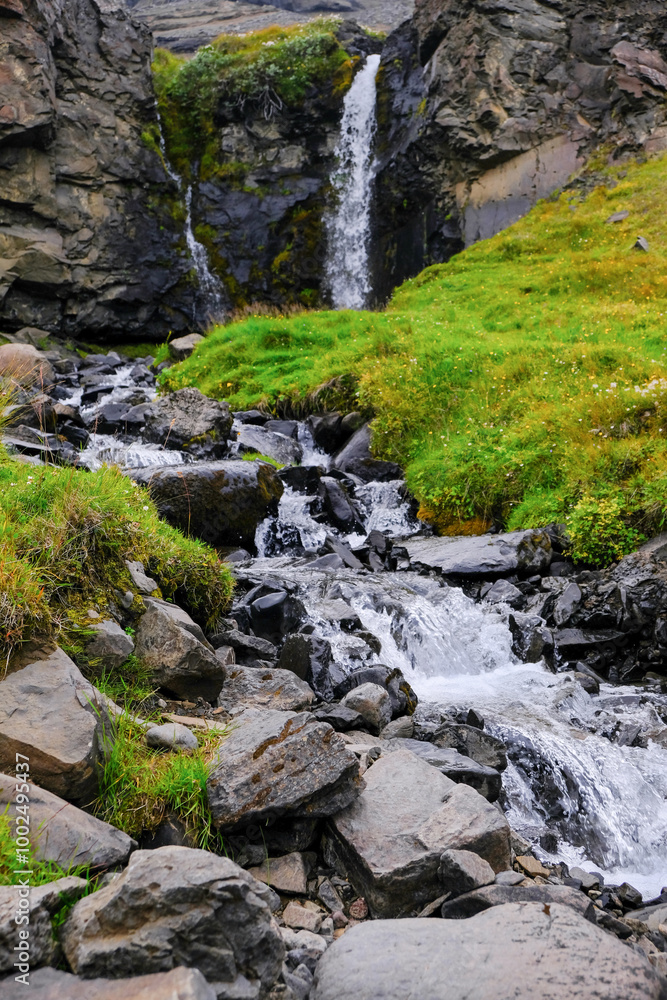 Cascading mountain stream with a waterfall in Iceland. Beautiful mountain river Cascading mountain stream with a waterfall in Iceland. Beautiful mountain river